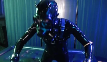 Rubberboy with gas mask pisses and cums